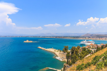 Bourtzi water fortress in Nafplio. Nafplio is a seaport town in the Peloponnese peninsula in Greece