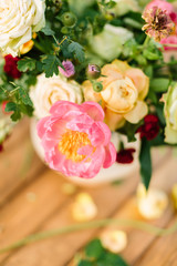 wedding, celebration, nature, gardening concept - close-up of chic bouquet composed of delicate avalanches, roses, dianthuses and tender peony, and decorated with leaves of oak and raspberry-bush