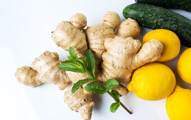 Ginger root with lemons and cucumbers