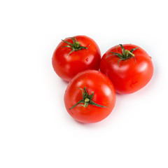 Red fresh tomatoes on a white isolated background
