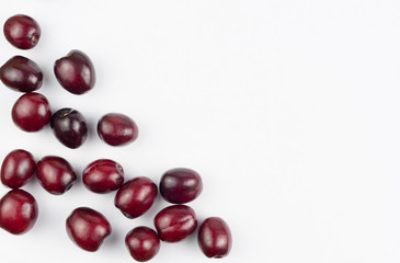 Many red fresh cherries on white background