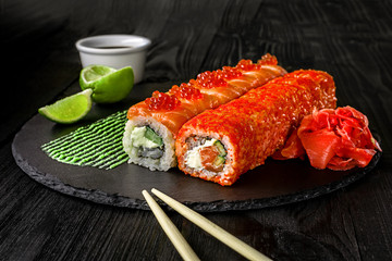 Philadelphia roll sushi with salmon, cucumber, cream cheese. Sushi menu. Japanese food.