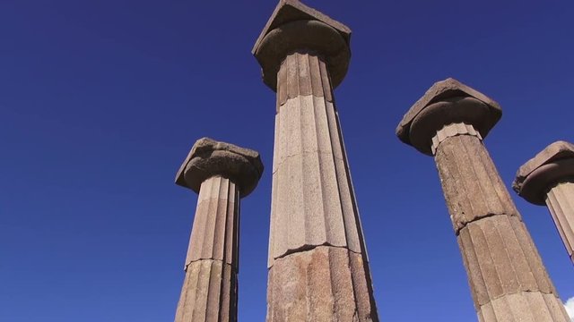 Antique columns on blue sky background