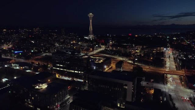 Seattle, WA Circa 2017: Aerial Panning Up to World Famous Space Needle at Night