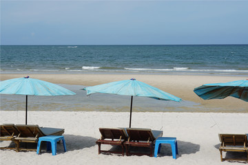 beach chair umbrella summer beach and clear water at Hua Hin