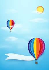 Obraz premium Colorful Hot air balloons flying with sun on blue sky background. Paper art and craft style