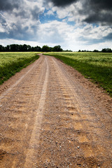 Gravel road in latvian countryside.