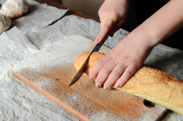Sliced bread on a wooden board.