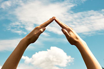 The combined hands, are forming a triangle