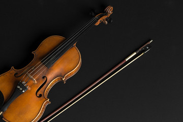 Fototapeta premium Old violin on a black background