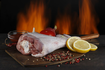 turkey (hen) with vegetables on fire background