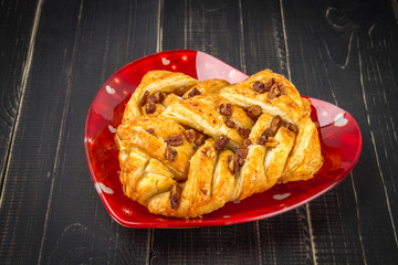 Danish pastry maple pecan with nuts and maple syrup