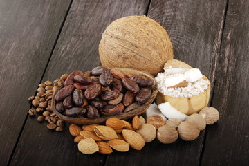 nuts and cacao on wooden background