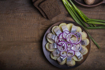 Salted herring with potatoes and onions