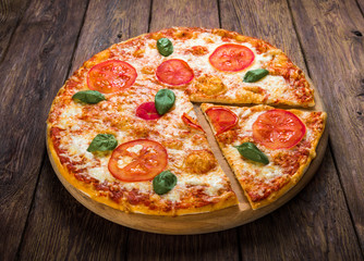 Delicious pizza with mozarella and tomatoes - Margherita