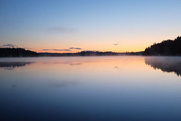 Fototapeta na wymiar Midnight sun landscape in Finland. Sunset colors at 1 am.