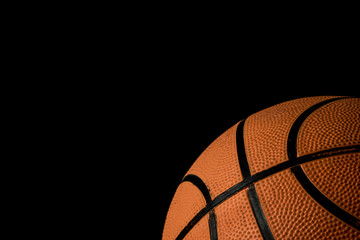 Fototapeta premium A single basketball isolated on a black background