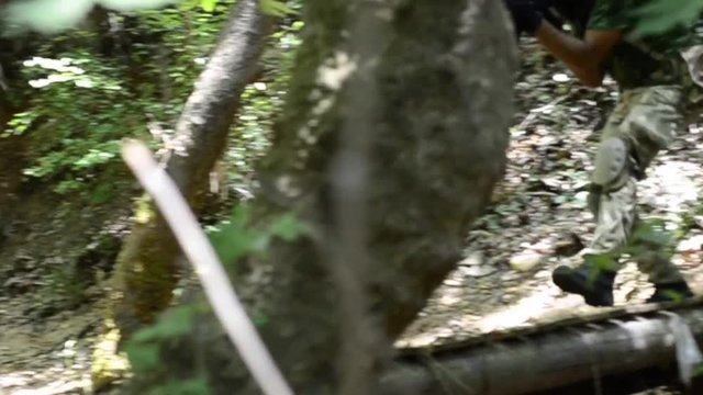 Jungle commando walk on wooden brige 