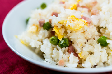Homemade Chinese fried rice with vegetables and fried eggs
