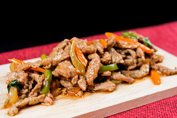 wok fried chicken stir fry with sweet peppers and chinese vegetables