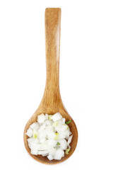 slices of white onion in wooden spoon isolated