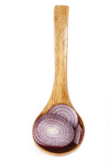 slices of red onion in wooden spoon isolated