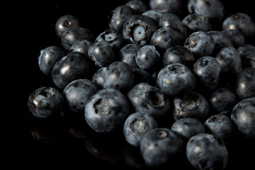A pile of blueberries isolated on black background