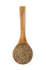cumin in wooden spoon isolated