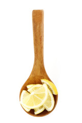slices of lemon in wooden spoon isolated