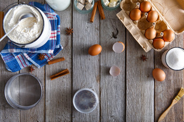 Baking ingredients on rustic wood background