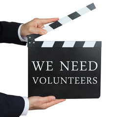 Obraz premium We need volunteers - written on a clapperboard