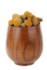 turmeric in wooden cup isolated