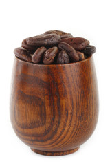 cacao beans  in wooden cup isolated