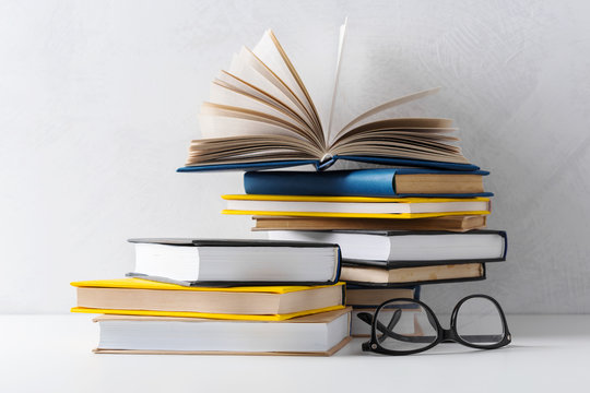  pile of paperback books on a table