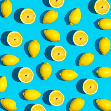 Fresh lemon pattern on a vivid blue background flat lay © Tierney
