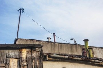 Fototapeta premium rooftops of poor sheds and buildings in slums