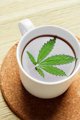Cannabis herbal tea and marijuana leaves