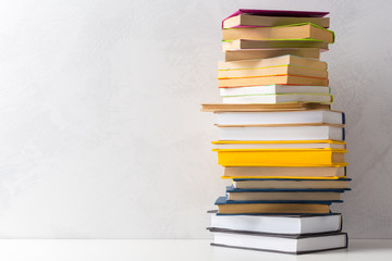  pile of paperback books on a table