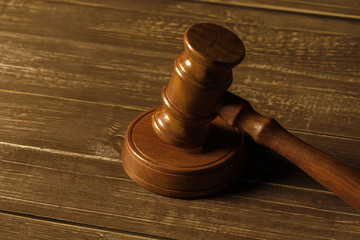 Close-up view of brown wooden mallet of judge