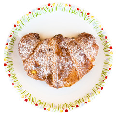 top view of croissant filled by cream on plate