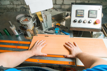 Man works for Edge Banding Machine