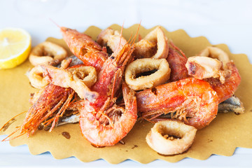 plate with fried seafood in sicilian restaurant