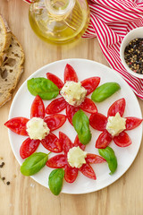 Tomato flowers stuffed with cheese and cucumber