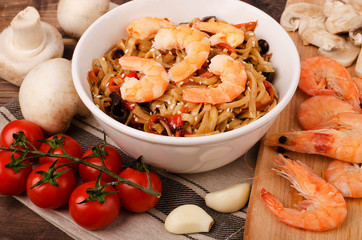 Chinese noodles with shrimp and vegetables in soy sauce