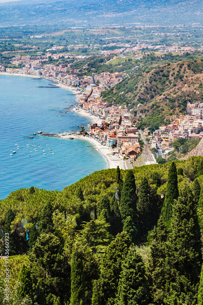 Sticker view of Giardini Naxos town on Ionian Sea shore