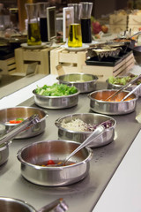 Self service salad bar with a variety of salads