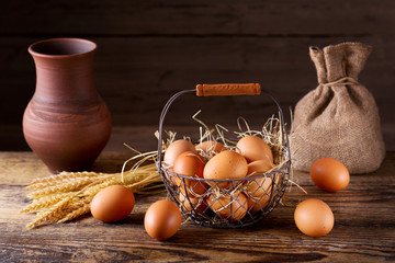 fresh brown eggs in a basket