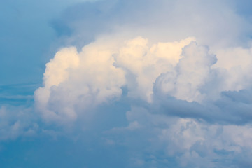 The blue backdrop has some clouds.