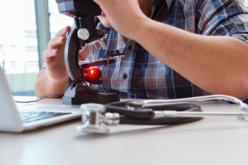 High precision engineering with man working with microscope