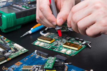 Electronic circuit board inspecting close up